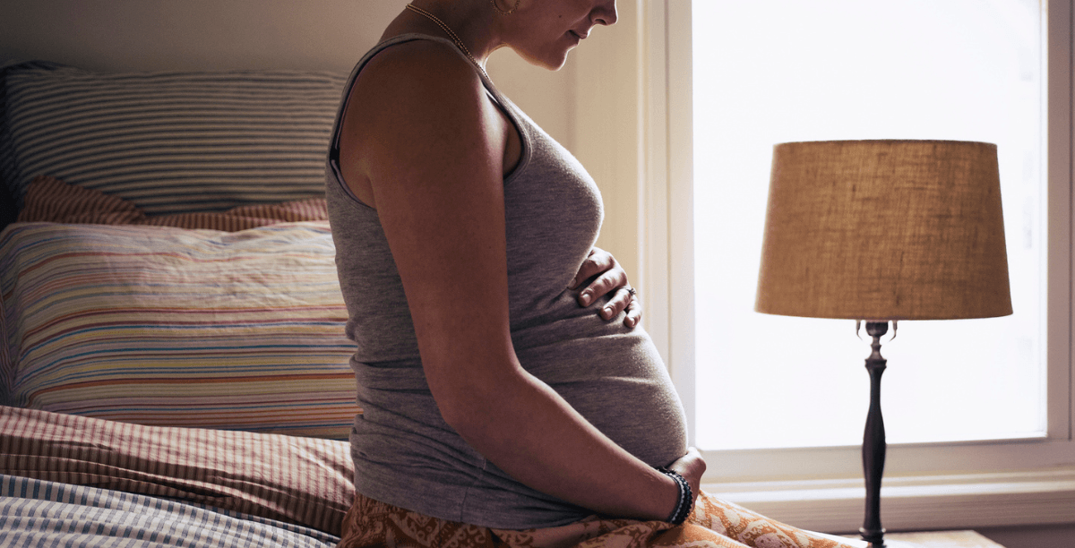 Pregnant woman in bed