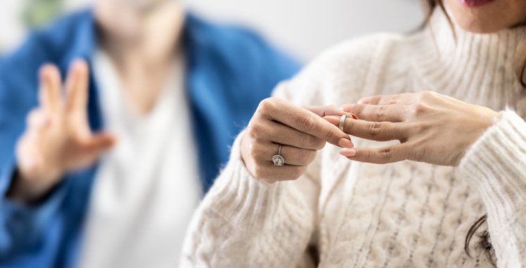 Woman removing her wedding ring