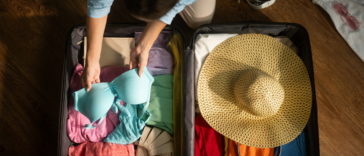 Woman packing suitcase