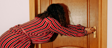 Woman pulling on door handle