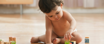 baby playing with blocks