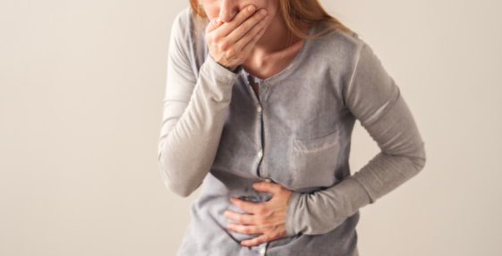Ill woman holding her stomach